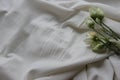 Lying flower on a bed with a sheet