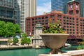 Flower Pot with Colorful Flowers along the Chicago River with Skyscrapers Royalty Free Stock Photo