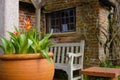 Flower pot in front of a rural clergy house in England Royalty Free Stock Photo