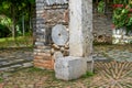 Flower pots and boulevards decorated with crock pots and stone millstones in the park