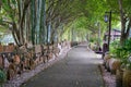 Flower pots and boulevards decorated with crock pots and stone millstones in the park