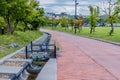 Flower pots on iron grate over water drainage ditch