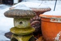 Flower pots & lawn decorations covered in snow