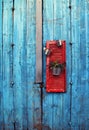 flower pots on red wooden shutter on an grange blue wall background Royalty Free Stock Photo