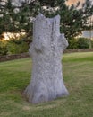 Flower relief carved on a tree trunk in the garden of the Gilcrease Museum in Tulsa, Oklahoma.