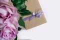 Flower rose pink violet purple gift box ribbon white background Royalty Free Stock Photo