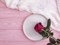 Flower rose plate vintage on wooden background arrangement