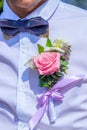 Flower rose in the shirt pocket of the groom. Groom decoration. Flower at a wedding Royalty Free Stock Photo