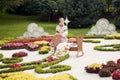 Flower sculpture of the mother and a child in cradle Ã¢â¬â Flower show in Ukraine, 2012
