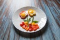 Flower shaped food art created with poach eggs, capsicums and vegetables Royalty Free Stock Photo