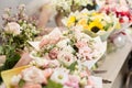 Bouquets on table, florist business. Different varieties fresh spring flowers. Delivery service. Flower shop concept. Royalty Free Stock Photo