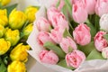 Tuips closeup. Flower shop concept. Mixed color. Fresh spring flowers in refrigerator room for flowers. Bouquets on Royalty Free Stock Photo