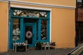 Flower shop with cozy blue showcase, Christmas decorations, Kolin in autumn day, Central Bohemia, Czech Republic