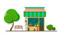 Flower shop on the street with a tree, bushes and a cozy bench on a white background. Vector illustration in cartoon flat style. Royalty Free Stock Photo