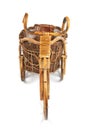 Flower stand in the form of a bicycle made from rattan. Front view