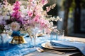 Flower table decorations for wedding dinner. Wedding table set for holiday, event, party, wedding reception in outdoor restaurant Royalty Free Stock Photo