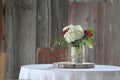 Flower table setting with barnwood background