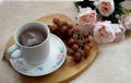 Flower tea cup somo grapes and peonies Royalty Free Stock Photo