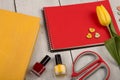 Flower tulip, blank red note pad, yellow book, scissors, nail po