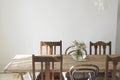 Flower vase on the top of a empty dining table