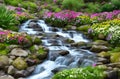 Tropical waterfall with flowers in garden scene painting for wall art Royalty Free Stock Photo