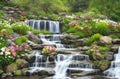 Tropical waterfall with flowers in garden scene painting for wall art Royalty Free Stock Photo