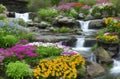 Tropical waterfall with flowers in garden scene painting for wall art Royalty Free Stock Photo