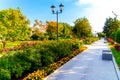 Flowerbeds, Grass Pathway and Ornamental Vase in a Formal Garden