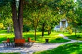 Flowerbeds, Grass Pathway and Ornamental Vase in a Formal Garden