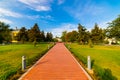 Flowerbeds, Grass Pathway and Ornamental Vase in a Formal Garden