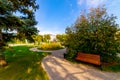 Flowerbeds, Grass Pathway and Ornamental Vase in a Formal Garden