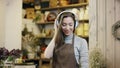 Flowergirl listening to music in big headphones and dancing, camera moves from far to the close-up view