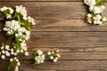 Flowering apple tree branch on wooden background. Spring concept. Flat layout. View from above. Copy space. Royalty Free Stock Photo