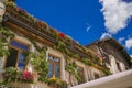 Flowering balcony in the historic center of San Candido, Italian Dolomites Royalty Free Stock Photo