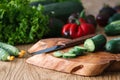 Flowering cucumbers on a wooden board