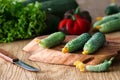 Flowering cucumbers on a wooden board