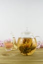 Flowering green tea and cup Royalty Free Stock Photo