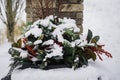 Flowerpot in public park covered in snow Royalty Free Stock Photo