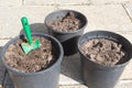Flowerpots with loam and gardening trowel Royalty Free Stock Photo