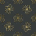 Delicate gold Apple flowers on a dark grey background.