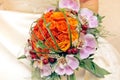 Nice bouquet of orange roses and orchids. Orchidaceae.