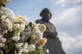 Flowers against a monument to Karl Marx