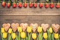 Flowers arranged on old boards. Floating frame. Gingerbread hearts.