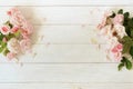 Flowers background . Bouquet of beautiful pink roses on white wooden background. Royalty Free Stock Photo