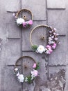 Flowers in bicycles wheel on the wall at the street of Przemysl