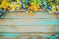 Flowers blossom on vintage wooden background, border frame design Royalty Free Stock Photo