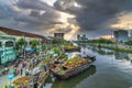 Flowers boat at flower market along canal wharf