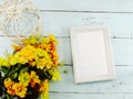 Flowers bouquet and blank photo frame with copy space background Royalty Free Stock Photo