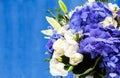 Flowers bouquet of blue hidrangea and white eustomas.