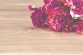 Flowers. A bouquet of lilac peonies lies on a wooden background